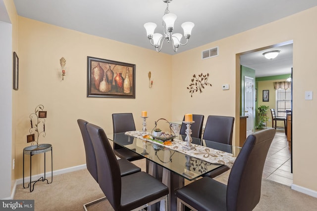 carpeted dining space with a notable chandelier