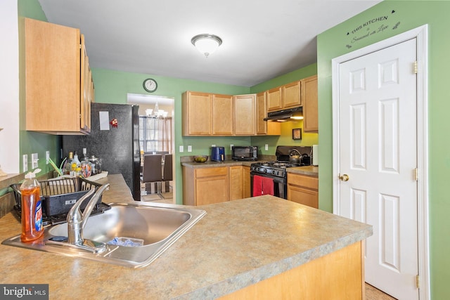 kitchen featuring light brown cabinets, black appliances, sink, kitchen peninsula, and a chandelier