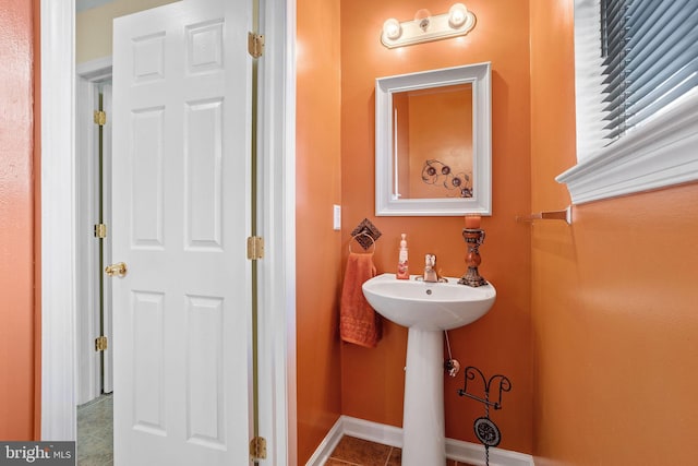 bathroom featuring tile patterned flooring and sink