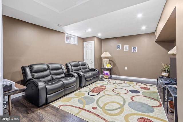 home theater room featuring dark wood-type flooring