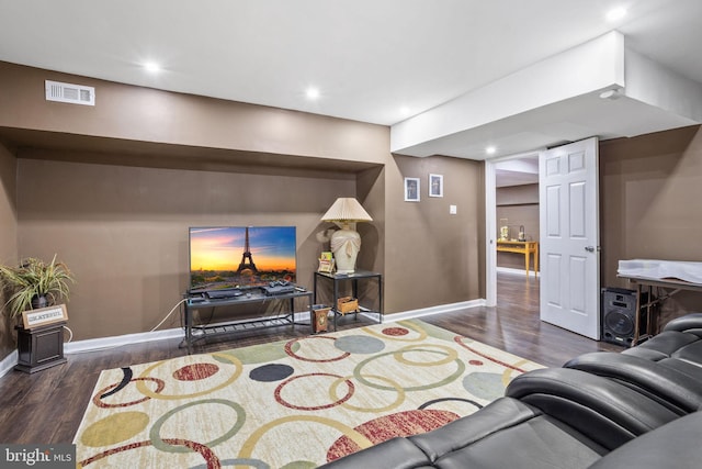 living room with dark hardwood / wood-style flooring