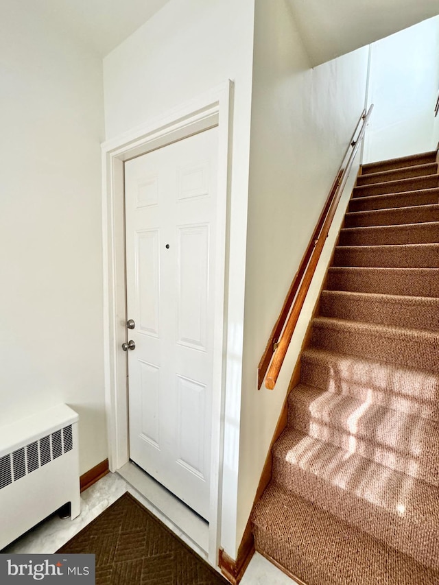 staircase with radiator