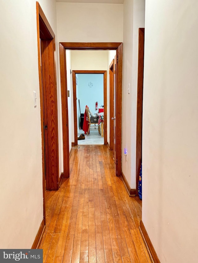 hall with light hardwood / wood-style floors