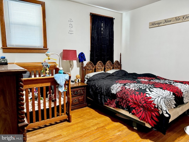 bedroom with hardwood / wood-style flooring