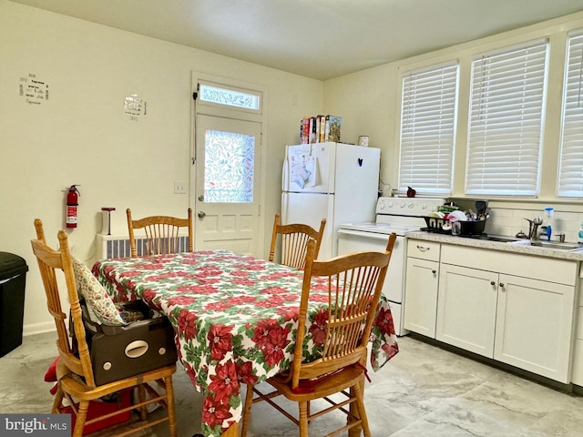 dining room featuring sink