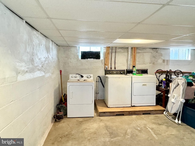 clothes washing area featuring separate washer and dryer