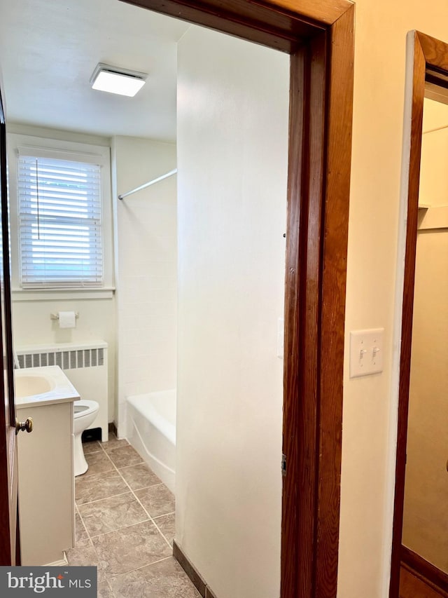 full bathroom with toilet, shower / tub combination, tile patterned floors, radiator, and vanity