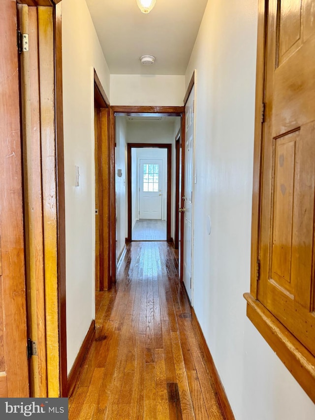 hallway featuring hardwood / wood-style floors