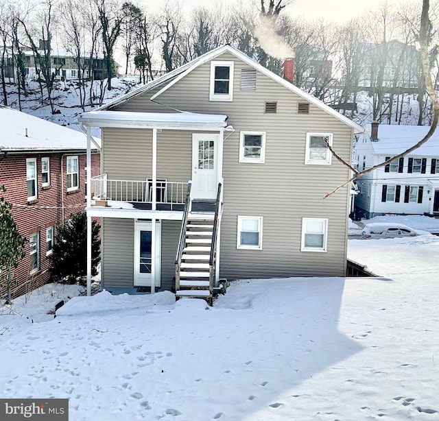 view of snow covered house