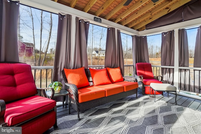 sunroom / solarium featuring lofted ceiling and wooden ceiling