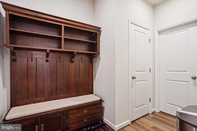 mudroom with light wood-style floors