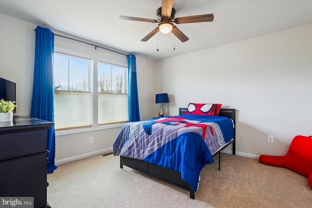 bedroom featuring ceiling fan, carpet, and baseboards