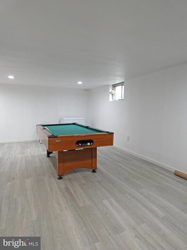 game room with billiards and light wood-type flooring