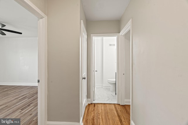 hall with light wood-type flooring