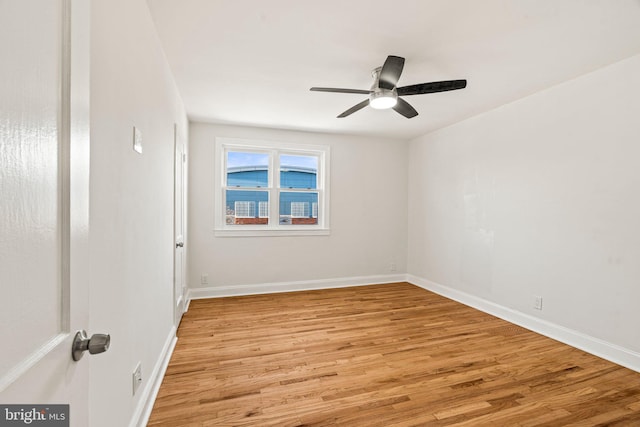 unfurnished room with light hardwood / wood-style flooring and ceiling fan