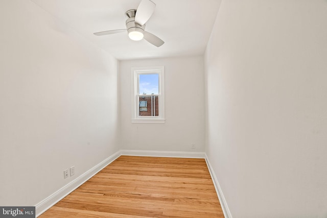 spare room with light wood-type flooring and ceiling fan