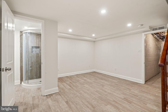 basement featuring light hardwood / wood-style floors