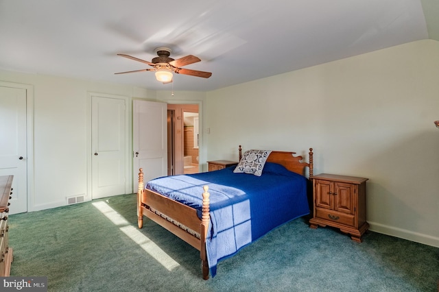 bedroom with ceiling fan and dark carpet