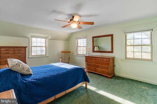 bedroom with ceiling fan, multiple windows, lofted ceiling, and carpet