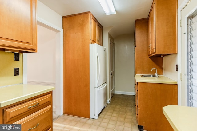 kitchen with white fridge and sink