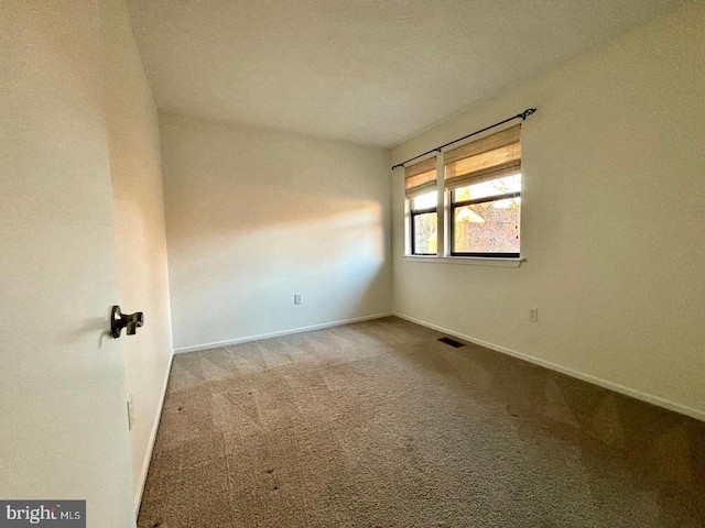 unfurnished room with light colored carpet