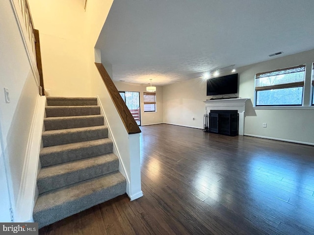 stairs featuring wood-type flooring