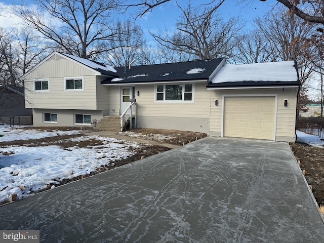 split level home featuring a garage