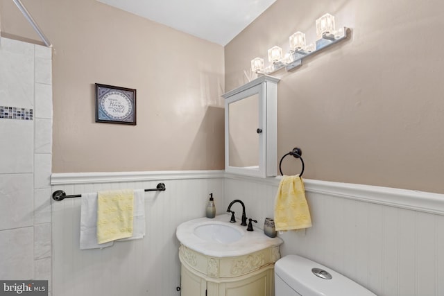 bathroom with toilet and vanity