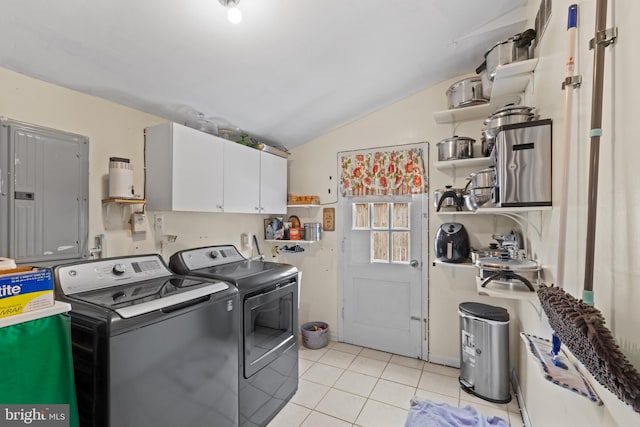 laundry room featuring electric panel, independent washer and dryer, cabinets, and light tile patterned floors