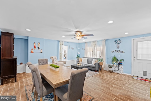 dining room with ceiling fan and light hardwood / wood-style floors