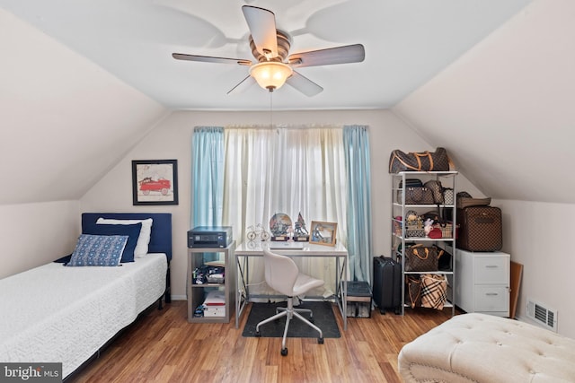 bedroom with lofted ceiling, wood-type flooring, and ceiling fan