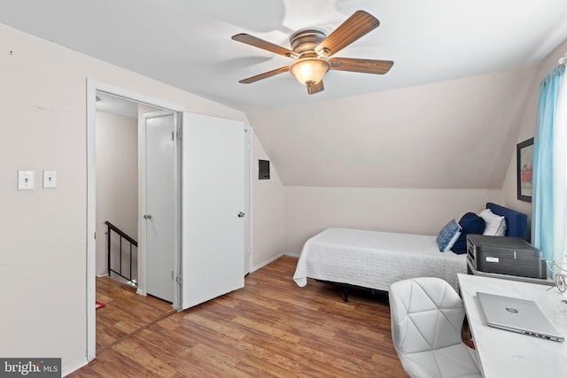 bedroom with vaulted ceiling, ceiling fan, light hardwood / wood-style flooring, and a closet