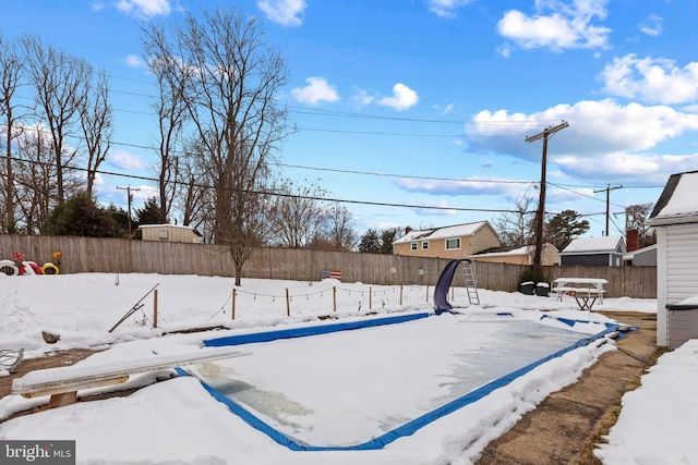 view of yard layered in snow