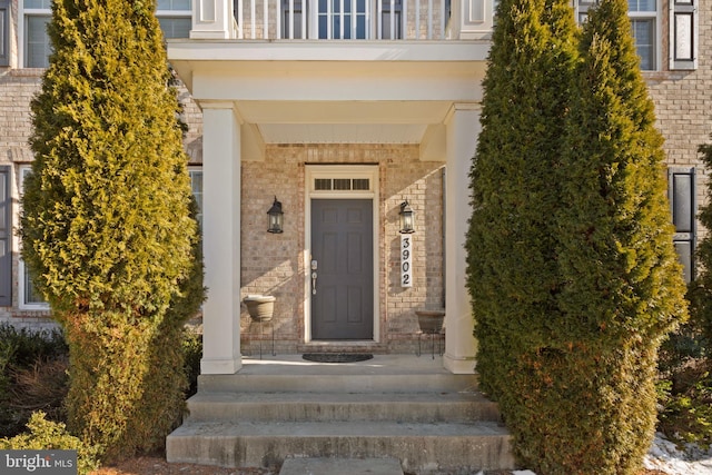 doorway to property featuring a balcony