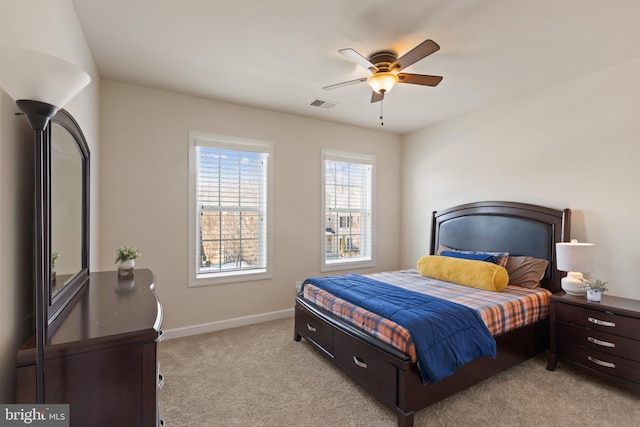 bedroom with light carpet and ceiling fan