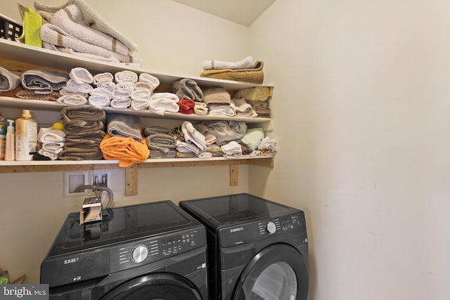 washroom featuring washer and clothes dryer