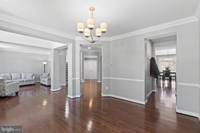 dining space featuring a chandelier, ornamental molding, and dark wood-type flooring