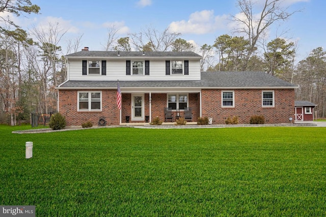 front of property featuring a front yard and a porch