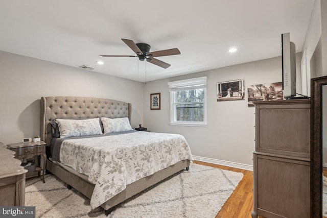 bedroom with ceiling fan and light wood-type flooring