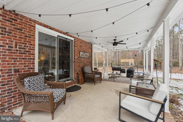 view of patio / terrace featuring ceiling fan, an outdoor hangout area, and grilling area