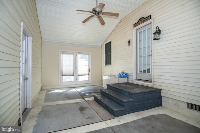 sunroom / solarium with ceiling fan, lofted ceiling, and french doors