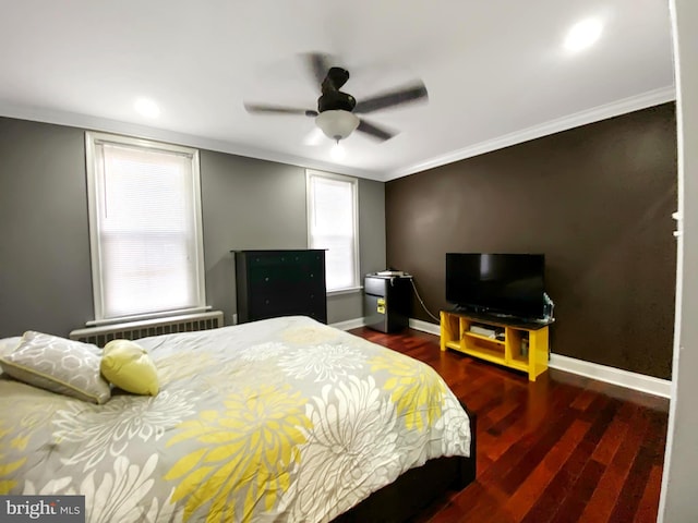 bedroom featuring multiple windows, ceiling fan, crown molding, and dark wood-type flooring