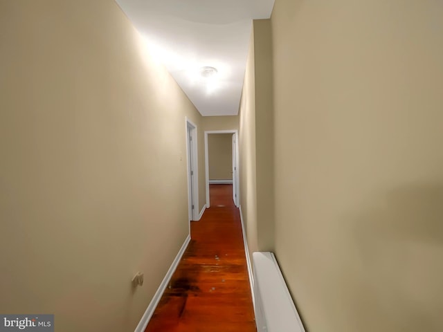 corridor featuring dark wood-type flooring