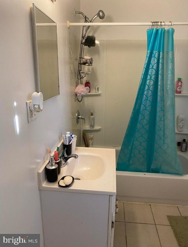 bathroom with shower / bath combination with curtain, vanity, and tile patterned flooring