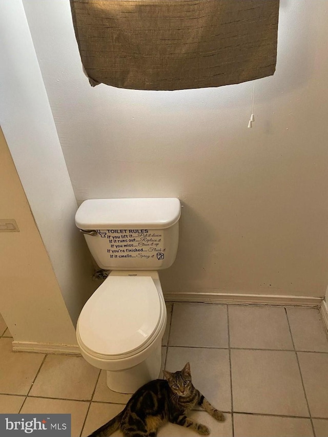 bathroom featuring tile patterned floors and toilet