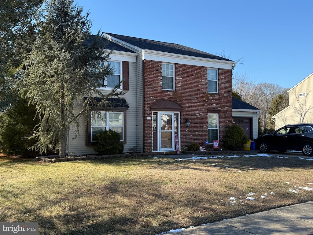 front facade with a front yard