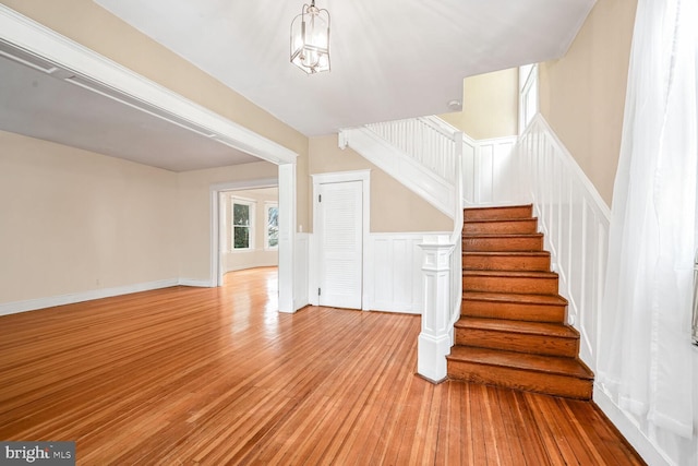 staircase with hardwood / wood-style flooring