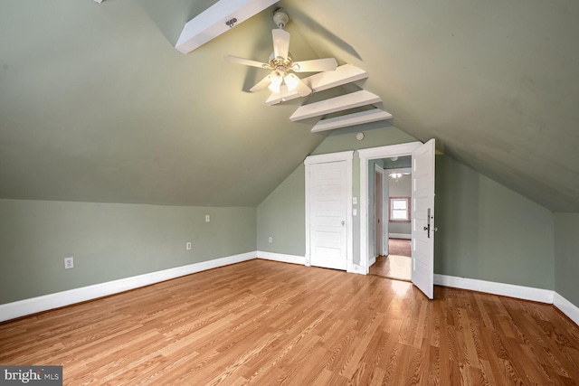 bonus room featuring ceiling fan, lofted ceiling, and light wood-type flooring