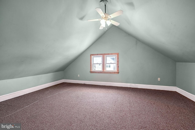 additional living space featuring carpet, lofted ceiling, and ceiling fan