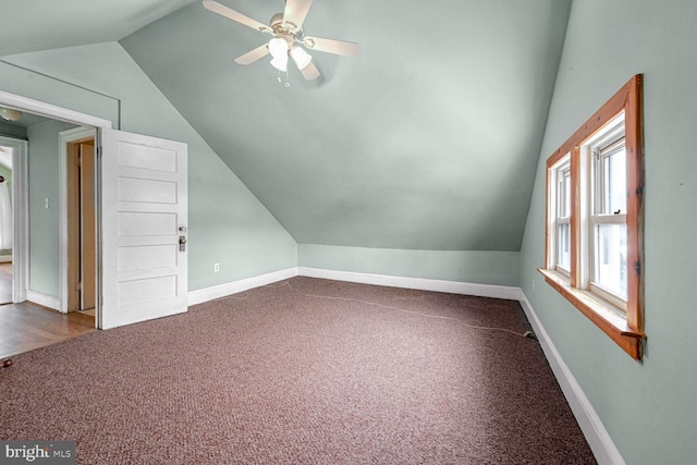 additional living space with vaulted ceiling, ceiling fan, and carpet